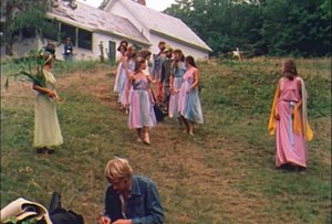 Cast members in costume walking down to the pond