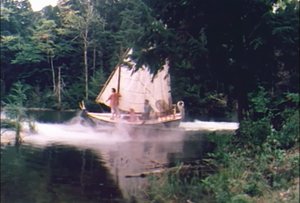 A ship sails through stage mist on the pond